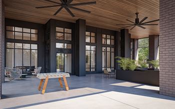 a patio with a table and chairs and two ceiling fans at Preston Ridge, North Carolina